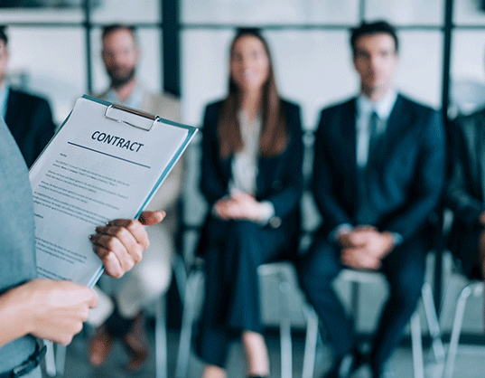 candidates for contract work sitting in a row